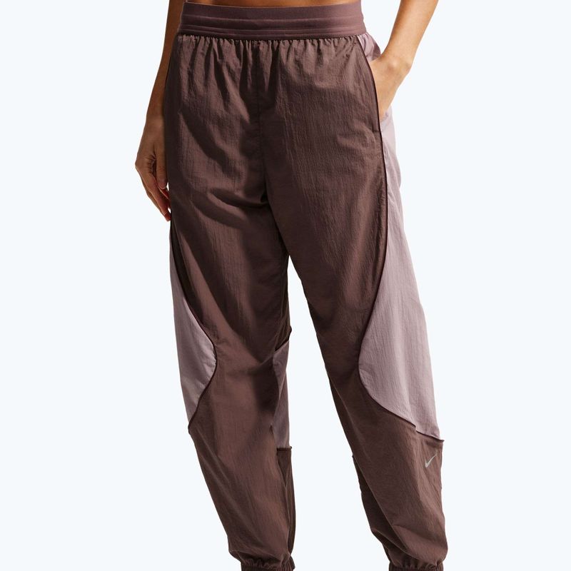 Women's running trousers Nike Swift UV Repel Mid-Rise tattoo/light violet ore 4